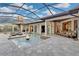 Inviting pool area with fire pit, ample seating, and screened enclosure at 9301 Tibet Pointe Cir, Windermere, FL 34786