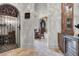 A home wine cellar with a wrought iron gate and a built-in wine cooler at 9301 Tibet Pointe Cir, Windermere, FL 34786