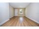 Light and airy living room with wood-look floors at 1431 39Th St, Orlando, FL 32839