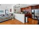 Modern kitchen with dark wood cabinets, granite counters, and stainless steel appliances at 155 S Court Ave # 1602, Orlando, FL 32801