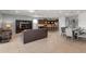 Open concept living and dining area with leather furniture at 1857 Gobi Dr, Kissimmee, FL 34747