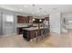 Kitchen with granite countertop island, dark cabinets at 1857 Gobi Dr, Kissimmee, FL 34747