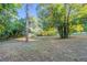 Large backyard with mature trees and open space at 1921 Rockwell Rd, Orlando, FL 32808