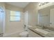 Updated bathroom with granite vanity and a bathtub at 1921 Rockwell Rd, Orlando, FL 32808