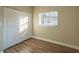 Spacious bedroom with wood-look floors and a closet at 1921 Rockwell Rd, Orlando, FL 32808