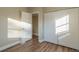 Well-lit bedroom with wood-look floors and double door closet at 1921 Rockwell Rd, Orlando, FL 32808