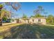 Ranch home with a large front yard and carport at 1921 Rockwell Rd, Orlando, FL 32808