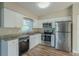 Modern kitchen featuring granite countertops and white cabinets at 1921 Rockwell Rd, Orlando, FL 32808