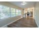 Open living room and kitchen with wood-look floors at 1921 Rockwell Rd, Orlando, FL 32808