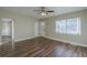 Bright living room with hardwood floors and ceiling fan at 1921 Rockwell Rd, Orlando, FL 32808