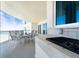 Balcony with an ocean view, outdoor grill, and dining table at 1925 S Atlantic Ave # 502, Daytona Beach, FL 32118