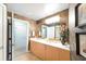 Bathroom with double vanity and access to hallway at 1925 S Atlantic Ave # 502, Daytona Beach, FL 32118