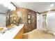 Bathroom with walk-in shower and decorative wallpaper at 1925 S Atlantic Ave # 502, Daytona Beach, FL 32118