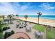 Beachfront view with firepit and seating areas at 1925 S Atlantic Ave # 502, Daytona Beach, FL 32118