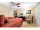 Twin bedroom with TV and ceiling fan at 1925 S Atlantic Ave # 502, Daytona Beach, FL 32118
