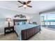 King bedroom with ocean view and ceiling fan at 1925 S Atlantic Ave # 502, Daytona Beach, FL 32118