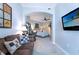 Spacious bedroom with sitting area and large TV at 1925 S Atlantic Ave # 502, Daytona Beach, FL 32118