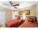 Bedroom with two twin beds and ceiling fan at 1925 S Atlantic Ave # 502, Daytona Beach, FL 32118