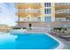 Relaxing pool area with ocean views and lounge chairs at 1925 S Atlantic Ave # 502, Daytona Beach, FL 32118