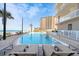 Resort-style pool with ocean views and plenty of lounge chairs at 1925 S Atlantic Ave # 502, Daytona Beach, FL 32118