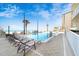 Inviting pool area with ocean views and lounge chairs at 1925 S Atlantic Ave # 502, Daytona Beach, FL 32118