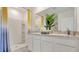 Modern bathroom with double vanity and walk-in shower at 2121 Pigeon Plum Dr, Haines City, FL 33844