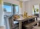 Bright dining area with sliding door access to patio at 2121 Pigeon Plum Dr, Haines City, FL 33844
