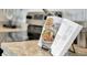 Kitchen counter with cookbook stand, offering a glimpse of modern appliances at 2121 Pigeon Plum Dr, Haines City, FL 33844