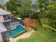 Screened-in pool and spa surrounded by lush landscaping and trees at 25510 High Hampton Cir, Sorrento, FL 32776