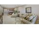Basement living area with a wet bar, comfortable seating area, and stylish decor at 25510 High Hampton Cir, Sorrento, FL 32776