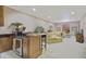 Finished basement with wet bar, comfortable seating, and tile flooring at 25510 High Hampton Cir, Sorrento, FL 32776