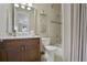 Bathroom with single vanity, shower, and toilet at 25510 High Hampton Cir, Sorrento, FL 32776