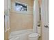 Clean bathroom with bathtub, shower, and toilet at 25510 High Hampton Cir, Sorrento, FL 32776
