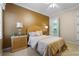 Bedroom featuring a comfortable bed, nightstands, and a walk-in closet at 25510 High Hampton Cir, Sorrento, FL 32776