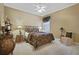 Cozy bedroom with ceiling fan, stylish furnishings, and soft carpeting at 25510 High Hampton Cir, Sorrento, FL 32776