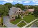 Beautiful curb appeal with a stone and stucco exterior, paver driveway, and manicured landscaping at 25510 High Hampton Cir, Sorrento, FL 32776