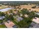 An aerial shot of the community, highlighting the proximity to a golf course and pond at 25510 High Hampton Cir, Sorrento, FL 32776
