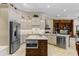 Kitchen with stainless steel appliances, an island with a built-in microwave, and ample counter space at 25510 High Hampton Cir, Sorrento, FL 32776
