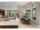 Kitchen with large island, breakfast nook, and view of the Gathering room at 25510 High Hampton Cir, Sorrento, FL 32776