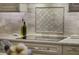 Modern kitchen with a smooth cooktop and decorative backsplash at 25510 High Hampton Cir, Sorrento, FL 32776