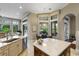 Open-concept kitchen with breakfast nook, overlooking the backyard at 25510 High Hampton Cir, Sorrento, FL 32776