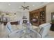 Open concept living room with fireplace, built-in shelves, and view of the kitchen at 25510 High Hampton Cir, Sorrento, FL 32776