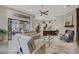 Spacious living area with large windows, comfortable seating, and access to the patio at 25510 High Hampton Cir, Sorrento, FL 32776