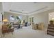 Welcoming living area filled with natural light from large windows at 25510 High Hampton Cir, Sorrento, FL 32776