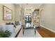 Living room with hardwood floors, a stylish couch, and a view of the foyer at 25510 High Hampton Cir, Sorrento, FL 32776