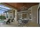 Covered patio with outdoor dining area and access to the pool at 25510 High Hampton Cir, Sorrento, FL 32776