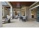 Covered patio with outdoor dining area and access to the interior at 25510 High Hampton Cir, Sorrento, FL 32776