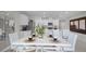 Dining area with white table and view of kitchen at 3771 Paragon Ln, Clermont, FL 34714