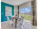 Breakfast nook with a round table and chairs, adjacent to sliding glass doors at 407 Cinnamon Dr, Kissimmee, FL 34759