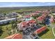 Aerial view of the building and surrounding area, with parking and landscaping at 445 Bouchelle Dr # 202, New Smyrna Beach, FL 32169
